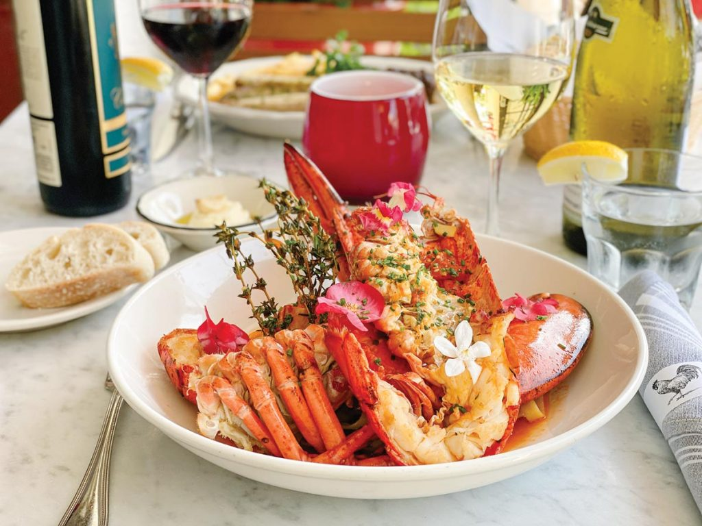 Whole lobster prix fixe entrée with wine at a Southwest Florida restaurant
